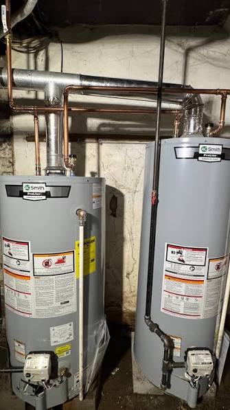 New tank water heater installed in a Maple basement utility room.